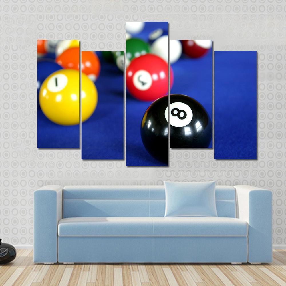 Pool Balls on Blue Table Canvas Wall Art in blue and multicolor, 4 panel Pop layout hung on a wall
