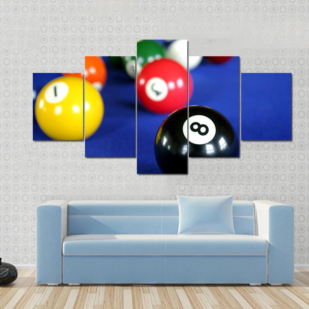Pool Balls on Blue Table Canvas Wall Art in blue and multicolor, 5 panel Star layout hung on a wall