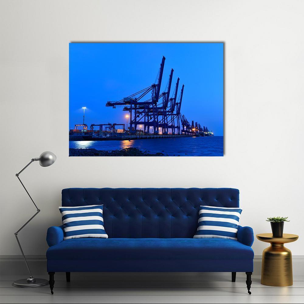 Gantry Cranes and Bulk Carrier Canvas Wall Art in black, blue and navy, single panel hung on a wall