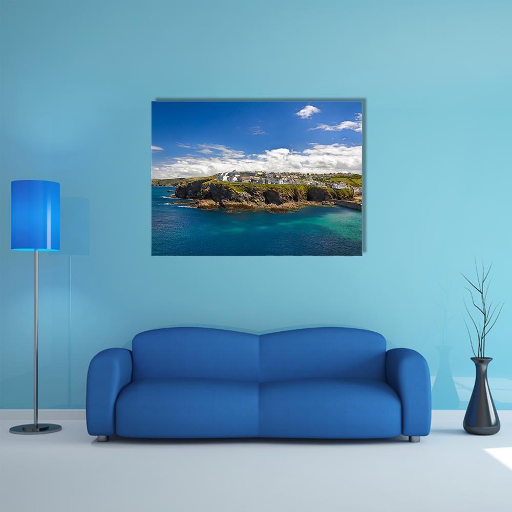 Peaceful Coastal Village by Clear Blue Water Canvas Wall Art in white, green and blue, single panel hung on a wall