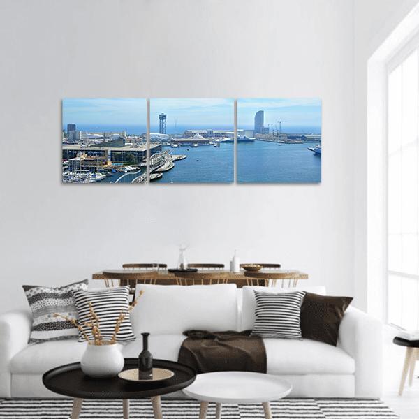 Port Vell and Maremagnum Barcelona Harbor Panoramic Canvas Wall Art in white, gray and blue, hung on a wall