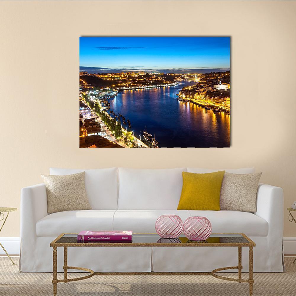 Porto Night View of the Douro River Canvas Wall Art in orange, yellow and blue, single panel hung on a wall