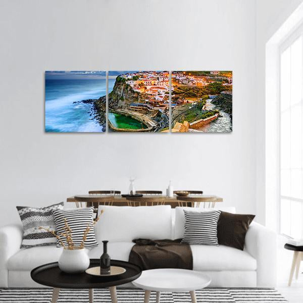 Portugal Cliffside Town at Dusk Panoramic Canvas Wall Art in brown, orange and blue, hung on a wall