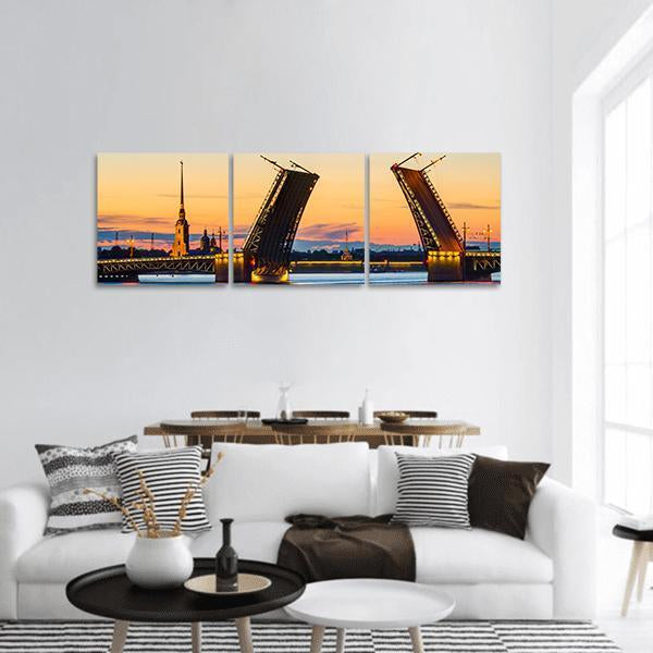 Palace Bridge at Dusk, St. Petersburg Panoramic Canvas Wall Art in orange, yellow and blue, hung on a wall