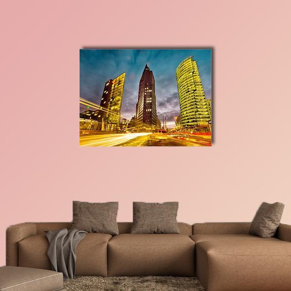 Potsdamer Platz Night Light Trails Canvas Wall Art in black, yellow and blue, single panel hung on a wall