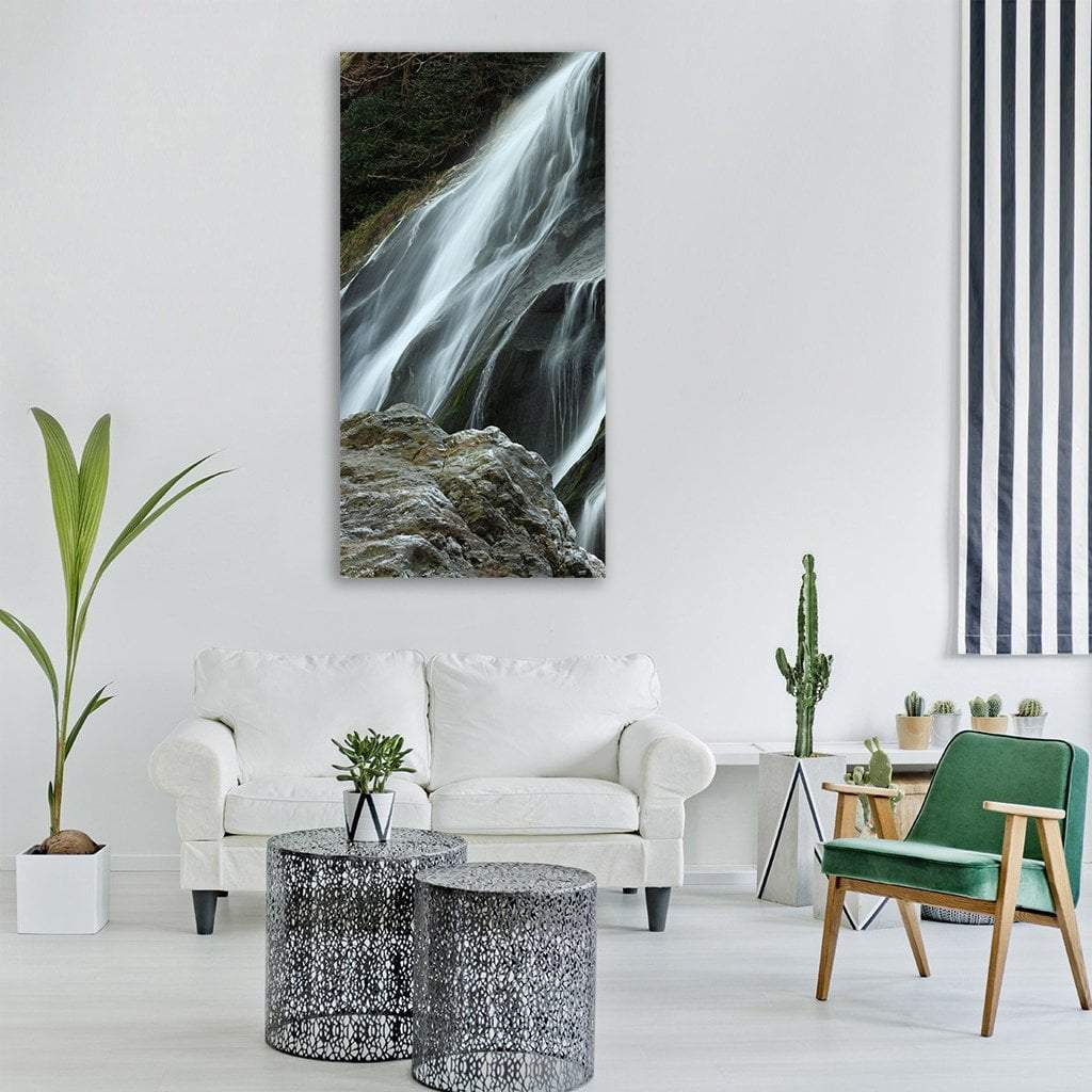 Powerscourt Waterfall in Ireland Vertical Canvas Wall Art in black, white and gray, single vertical panel hung on a wall