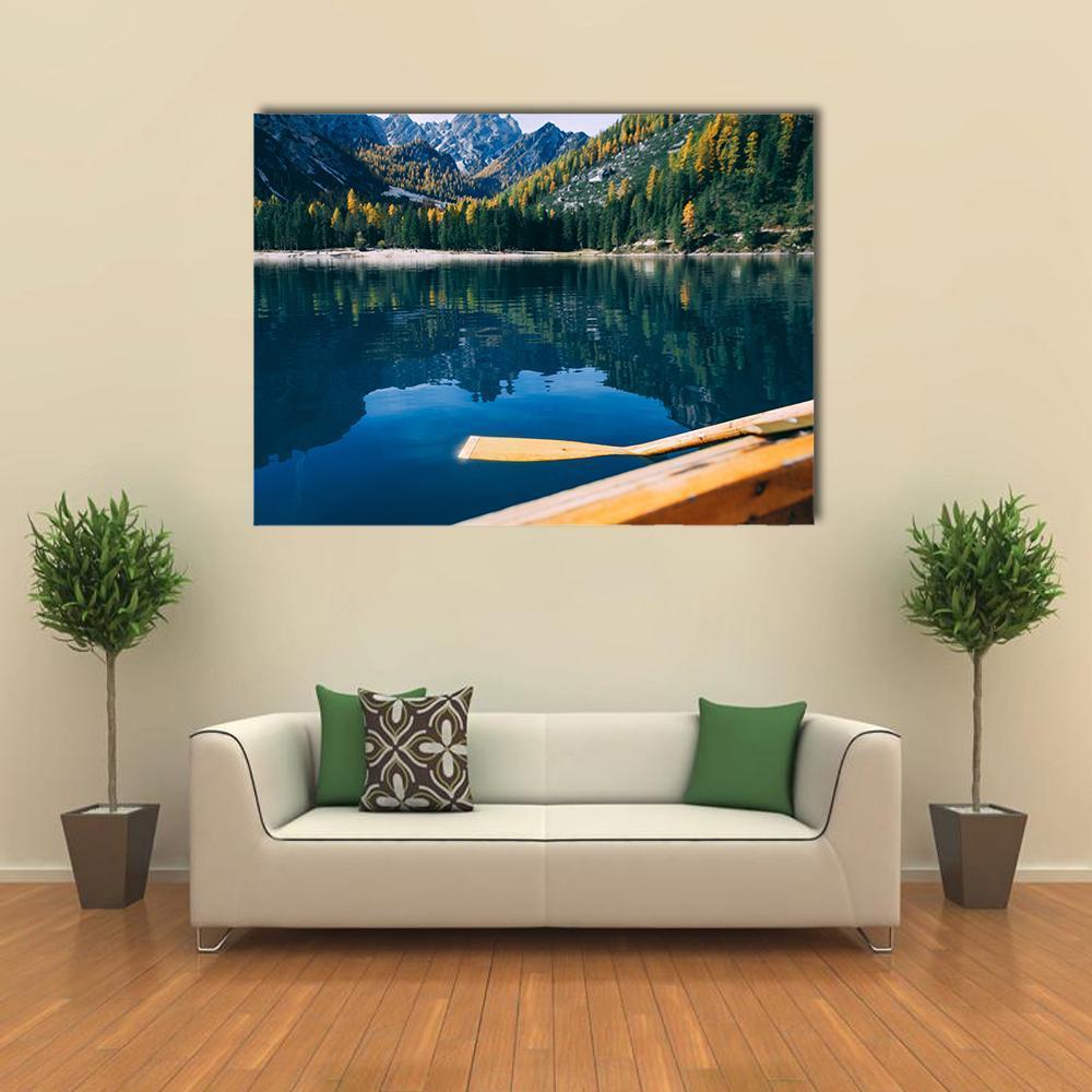 Canoe on Pragser Wildsee Canvas Wall Art in brown, green and blue, single panel hung on a wall