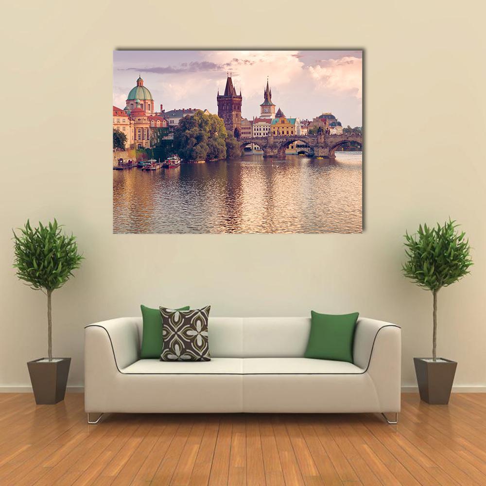 Prague Old Town River View Canvas Wall Art in brown, orange and pink, single panel hung on a wall