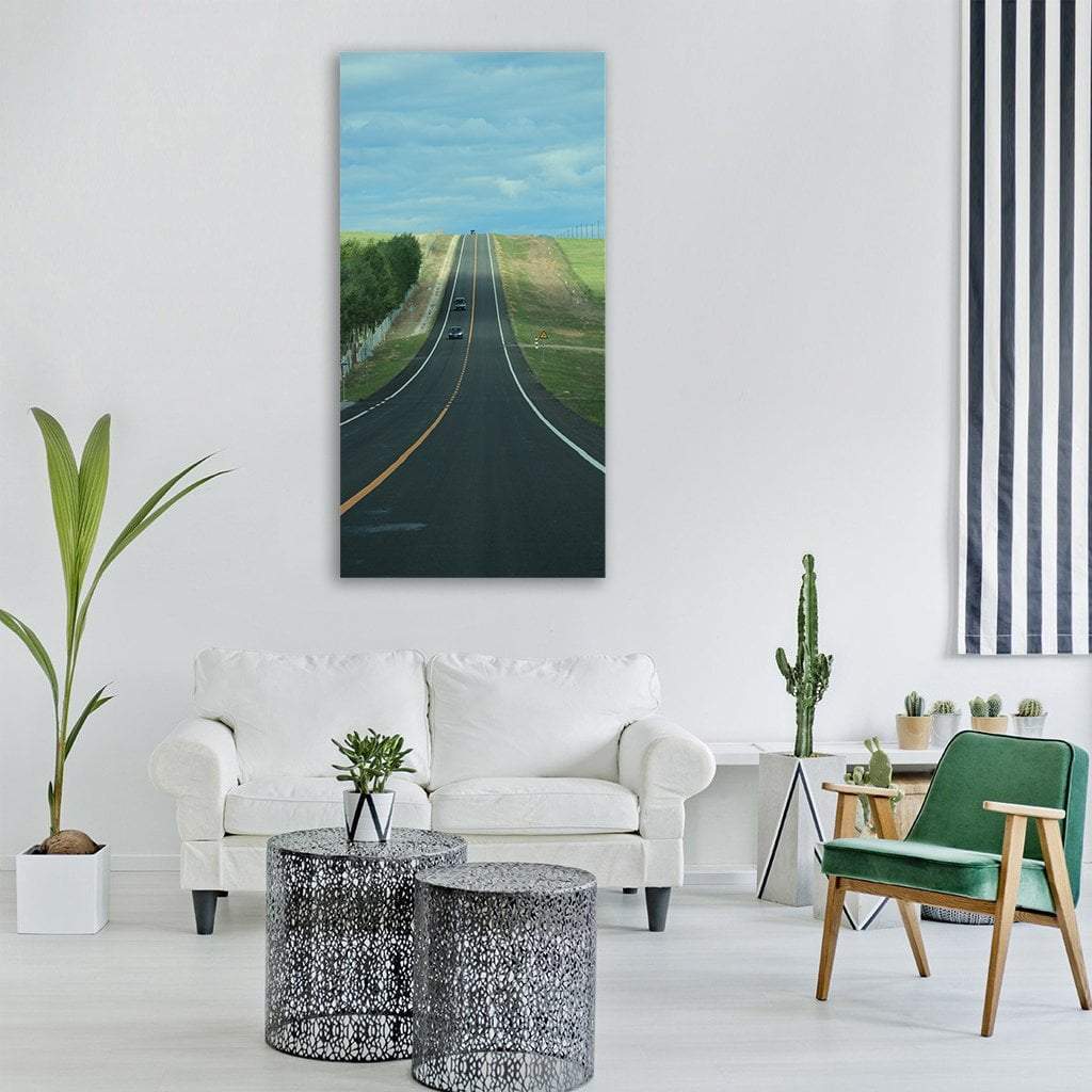 Prairie Highway Vertical Canvas Wall Art in black, green and blue, single vertical panel hung on a wall