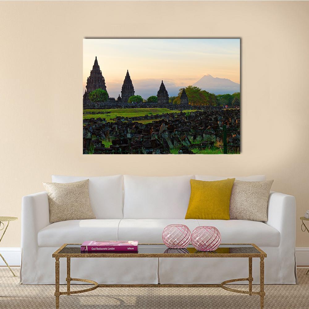 Prambanan Hindu Temple at Sunset Canvas Wall Art in gray, orange and green, single panel hung on a wall