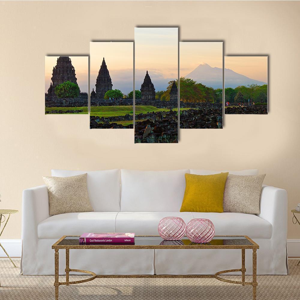 Prambanan Hindu Temple at Sunset Canvas Wall Art in gray, orange and green, 5 panel Star layout hung on a wall