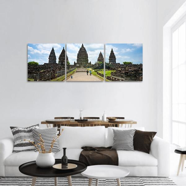 Prambanan Temple in Indonesia Panoramic Canvas Wall Art in gray, brown and blue, hung on a wall