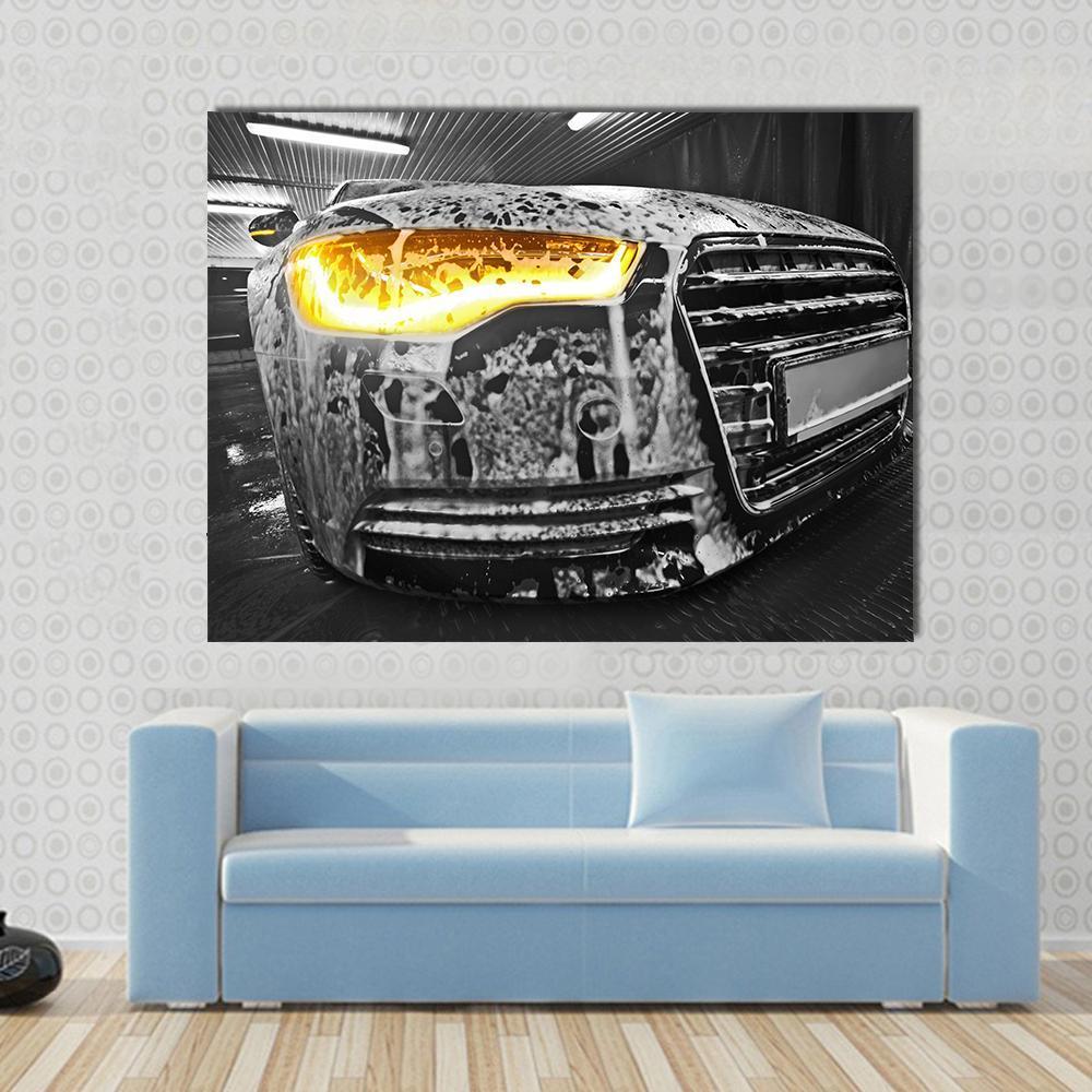 Black Car Covered in Soap Suds Canvas Wall Art in black, white and yellow, single panel hung on a wall