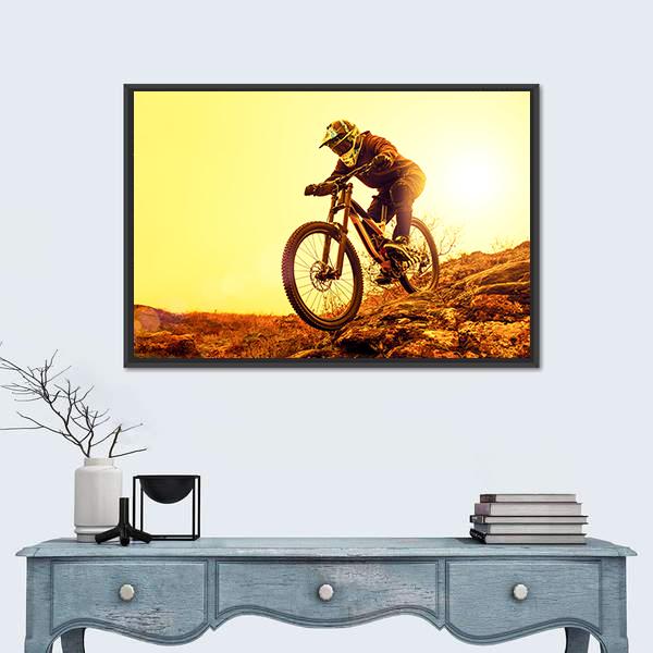 Cyclist Riding Mountain Bike Canvas Wall Art in brown, orange and yellow, framed canvas, product view on a white background