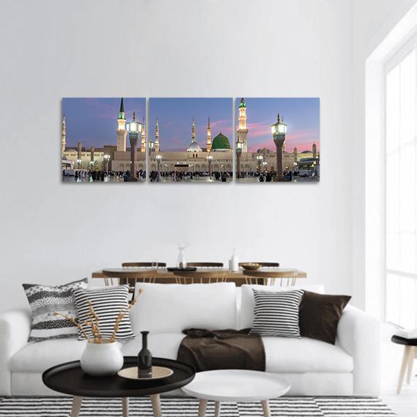 Prophet's Mosque, Medina at Twilight Panoramic Canvas Wall Art in beige, blue and pink, hung on a wall