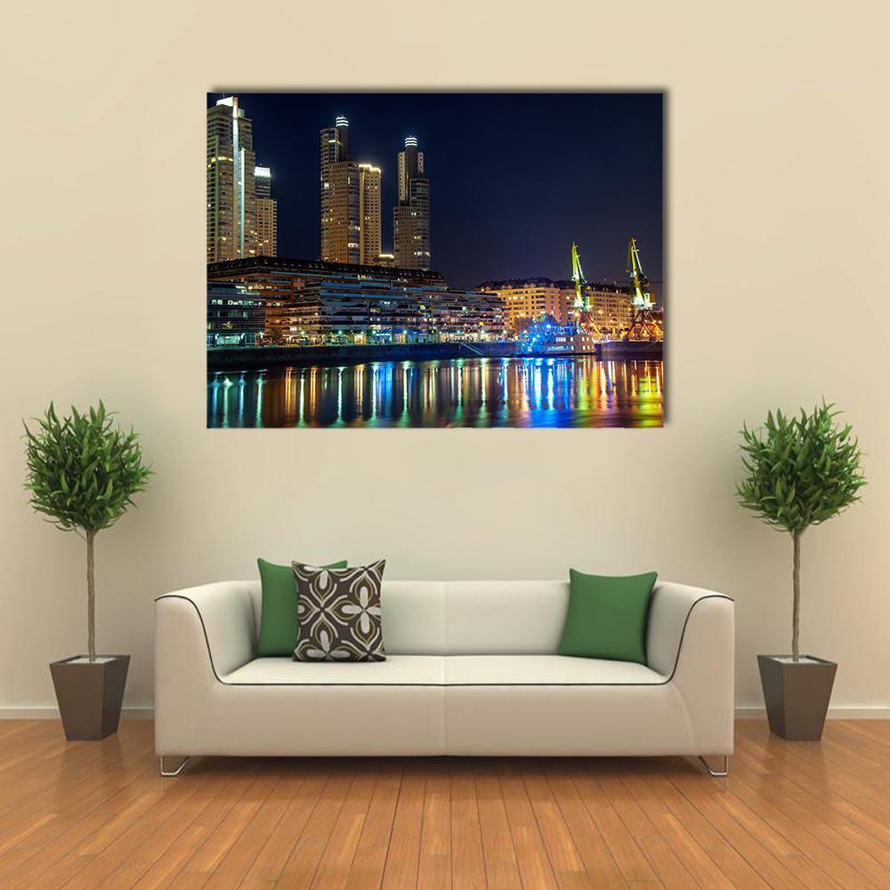 Puerto Madero City Skyline at Night Canvas Wall Art in black, gold and blue, single panel hung on a wall