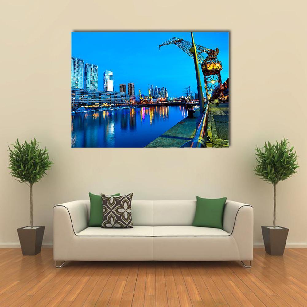 Puerto Madero Cityscape at Night Canvas Wall Art in black, yellow and blue, single panel hung on a wall