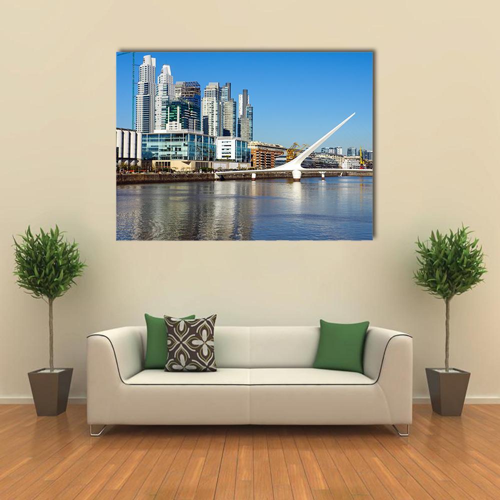Puerto Madero Cityscape with Suspension Bridge Canvas Wall Art in white, gray and blue, single panel hung on a wall
