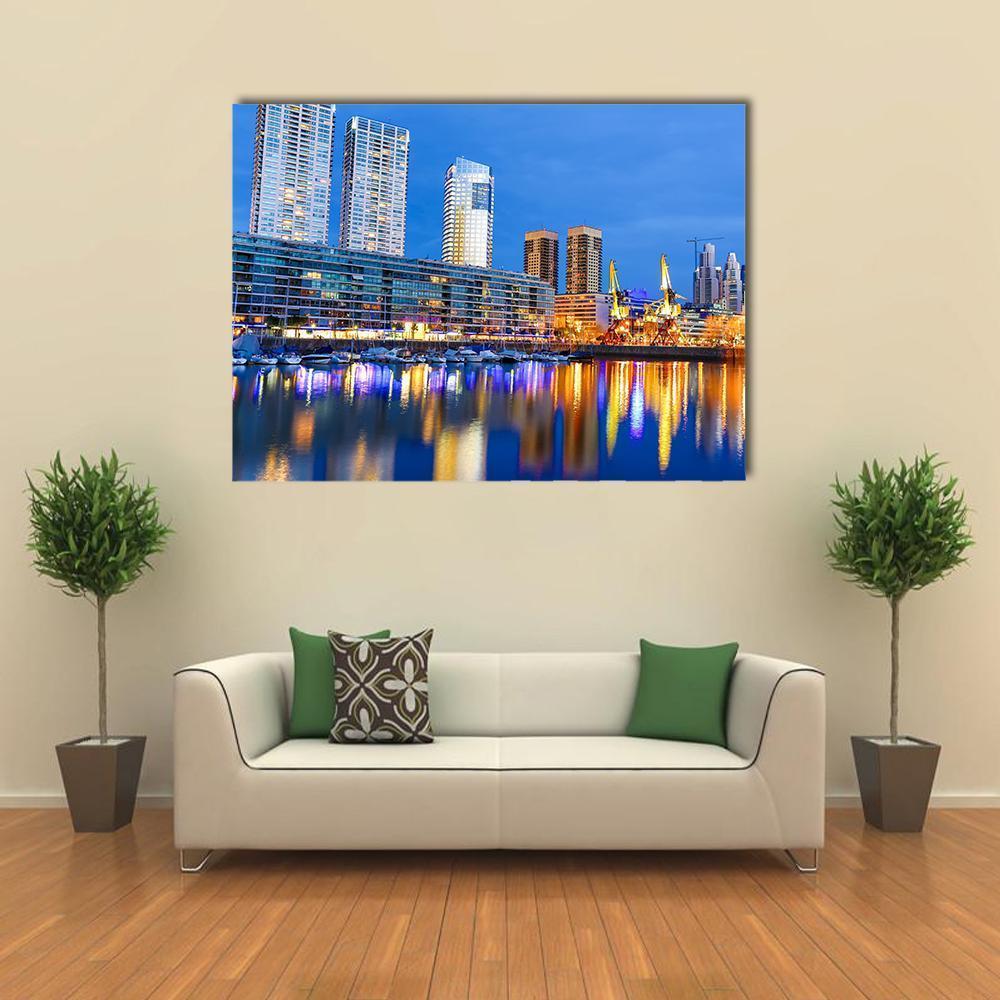 Puerto Madero Nighttime Skyline Canvas Wall Art in gold, yellow and blue, single panel hung on a wall