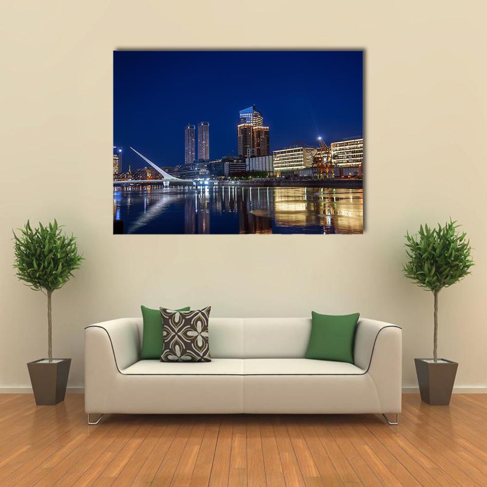 Puerto Madero City Skyline at Night Canvas Wall Art in yellow, blue and navy, single panel hung on a wall