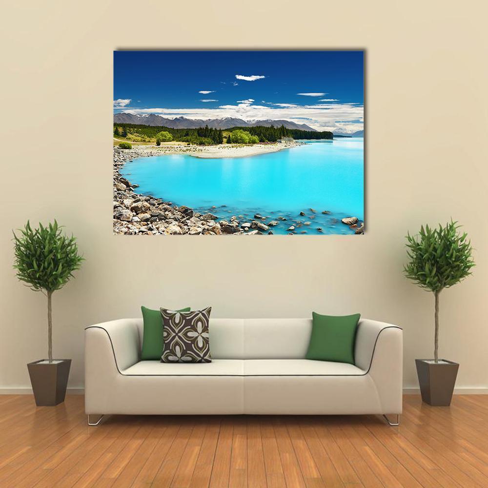 Pukaki Lake Turquoise Waters Canvas Wall Art in white, brown and blue, single panel hung on a wall