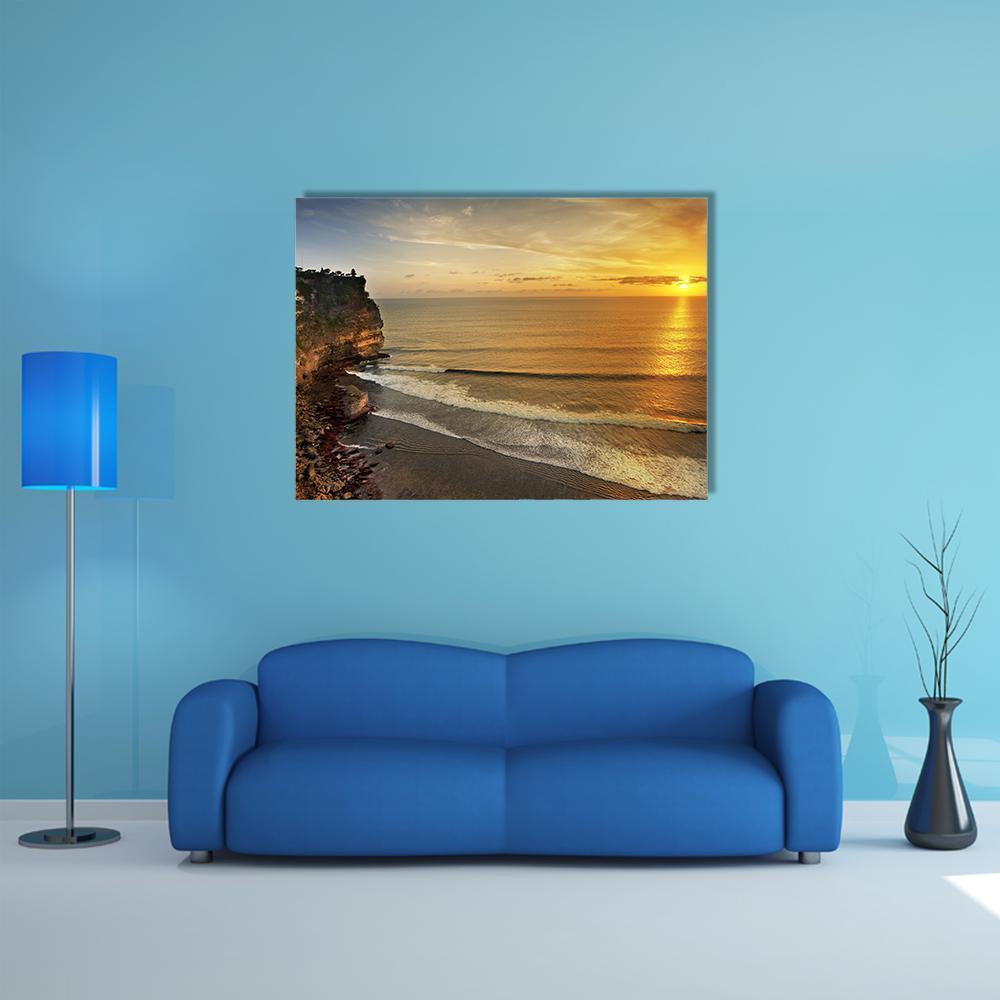 Pura Uluwatu Temple at Sunset Canvas Wall Art in brown, orange and yellow, single panel hung on a wall