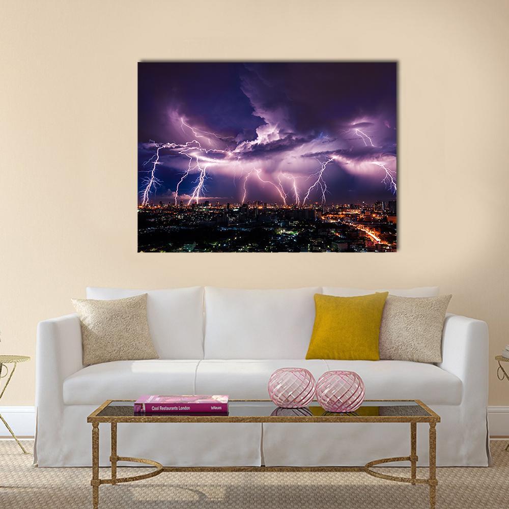 Purple Lightning Over City Canvas Wall Art in black and purple, single panel hung on a wall