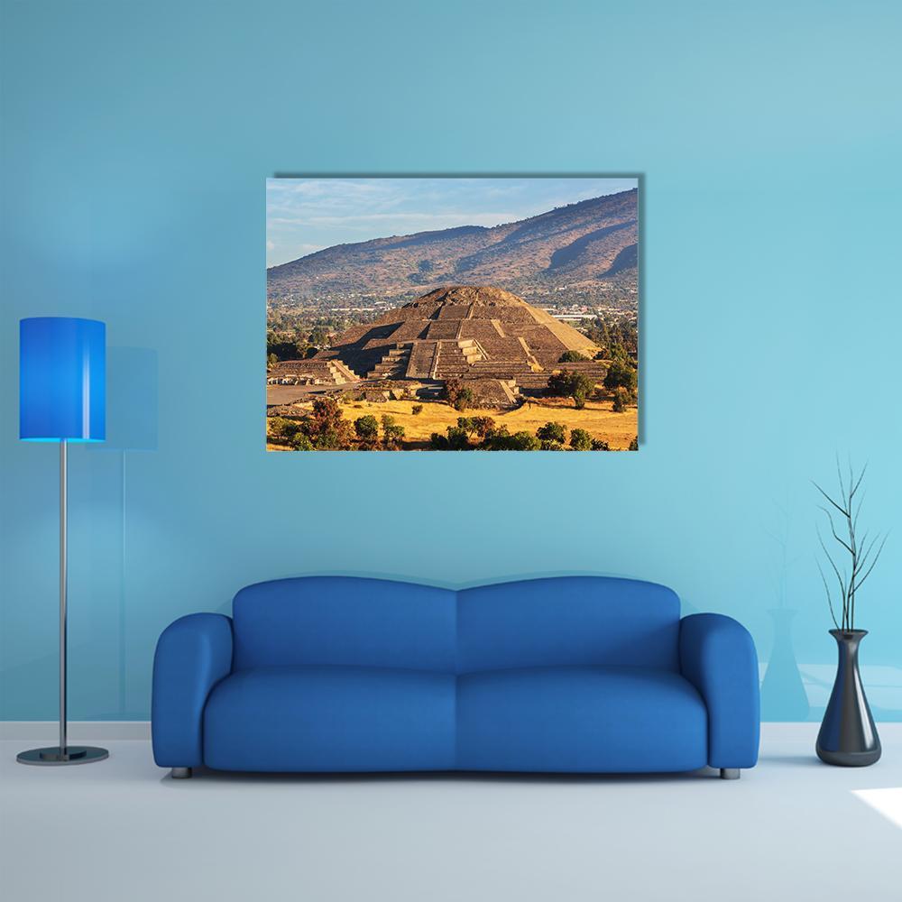 Pyramid of the Sun, Teotihuacan Canvas Wall Art in brown, gold and blue, single panel hung on a wall