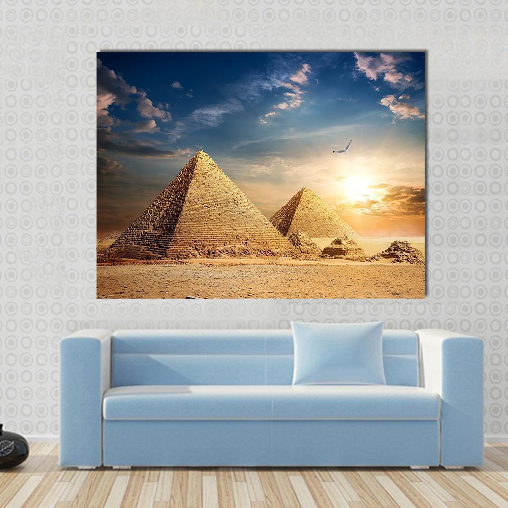 Pyramids at the Sunset Canvas Wall Art in orange, yellow and blue, single panel hung on a wall