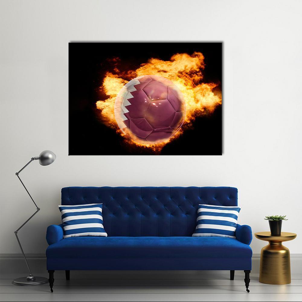 Qatar Flag Soccer Ball in Flames Canvas Wall Art in black, red and orange, single panel hung on a wall