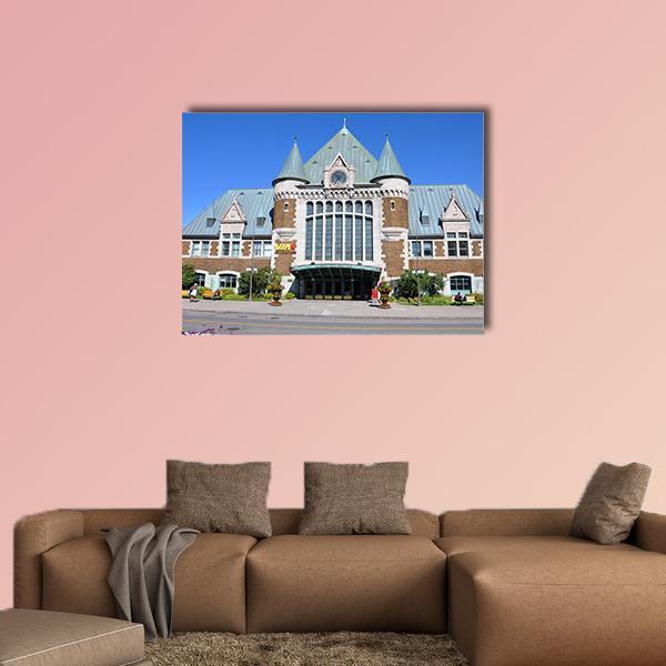 Quebec City Bus and Train Terminal Canvas Wall Art in gray, brown and blue, single panel hung on a wall