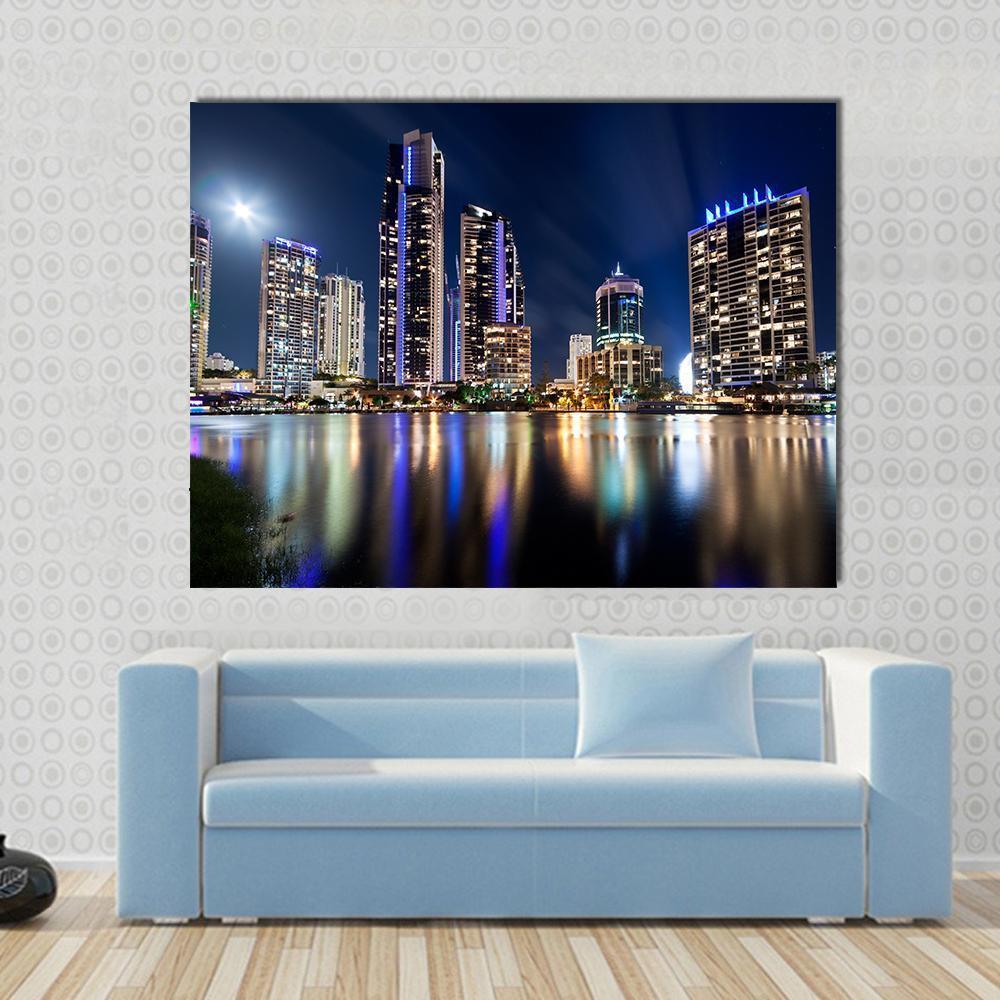 Queensland City at Night Canvas Wall Art in black, yellow and blue, single panel hung on a wall
