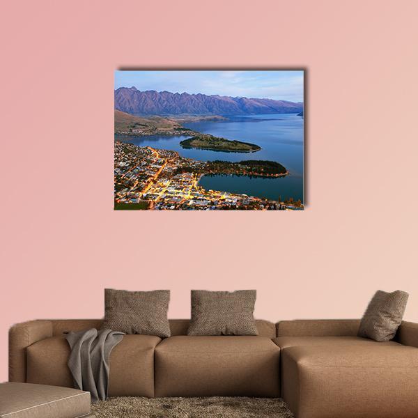 Queenstown Downtown at Dusk Canvas Wall Art in orange, blue and purple, single panel hung on a wall