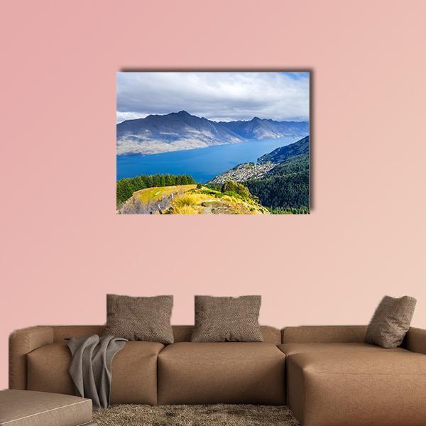 Lake Wakatipu Landscape Canvas Wall Art in gray, green and blue, single panel hung on a wall