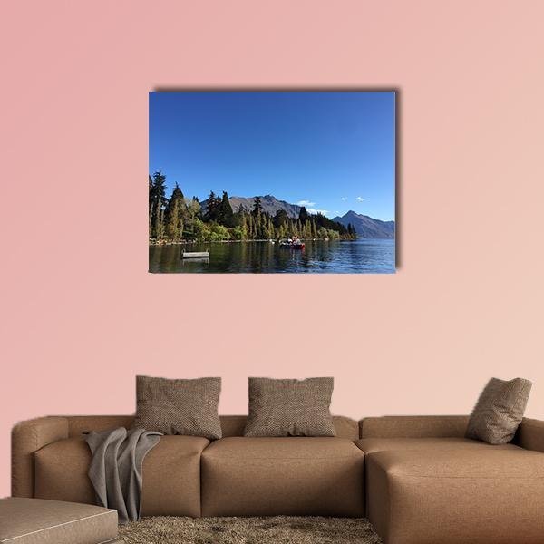 Queenstown Turquoise Lake Waterfront Canvas Wall Art in green and blue, single panel hung on a wall