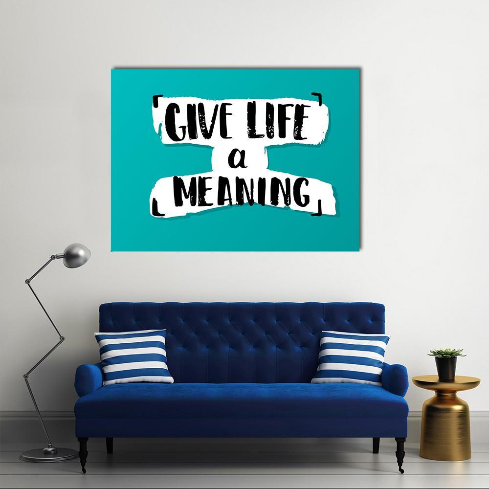 Give Life a Meaning Handwritten Quote Canvas Wall Art in black, white and blue, single panel hung on a wall