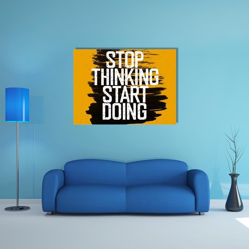 Stop Thinking Start Doing Canvas Wall Art in black, white and yellow, single panel hung on a wall