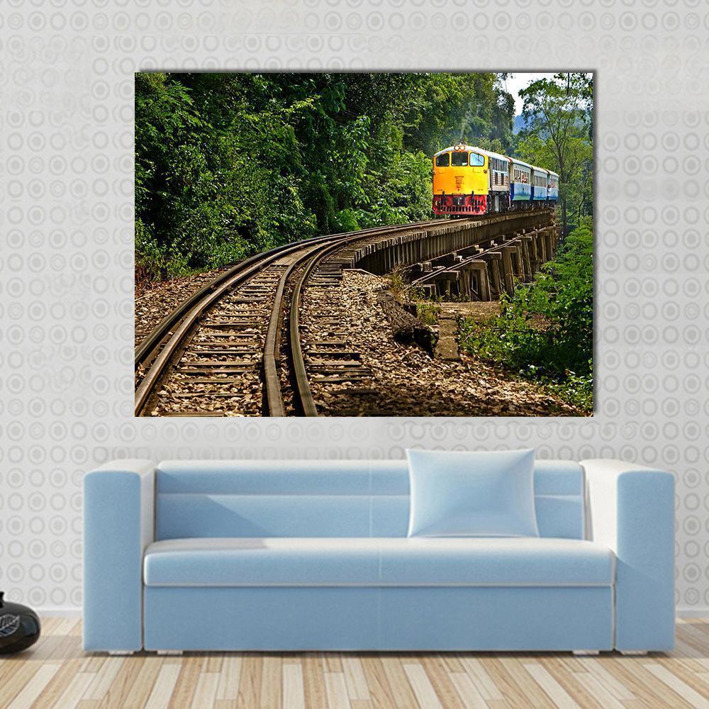 Rail Travel in Kanchanaburi Province Thailand Canvas Wall Art in brown, yellow and green, single panel hung on a wall