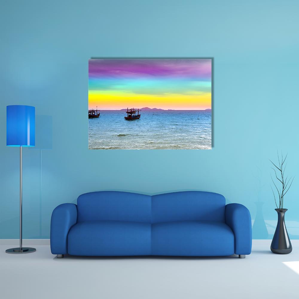Two Boats at Rainbow Sunset Over Calm Sea Canvas Wall Art in yellow, blue and purple, single panel hung on a wall