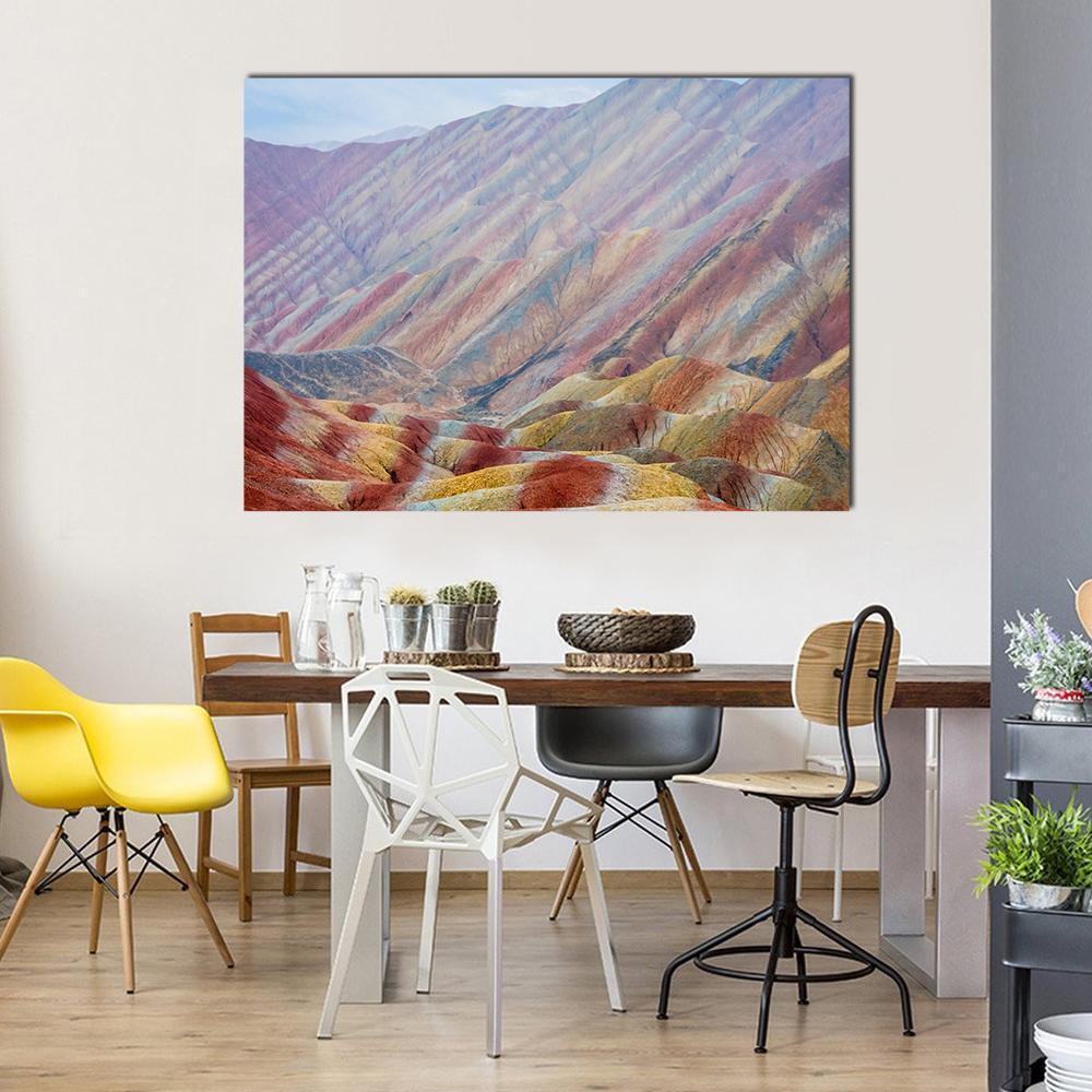 Colorful Rainbow Mountains in China Canvas Wall Art in red, yellow and multicolor, single panel hung on a wall