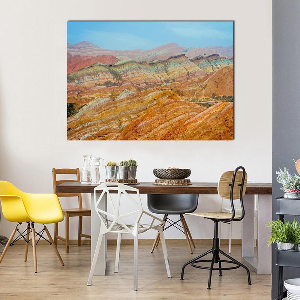 Vibrant Rainbow Mountains in Zhangye Canvas Wall Art in red, orange and multicolor, single panel hung on a wall