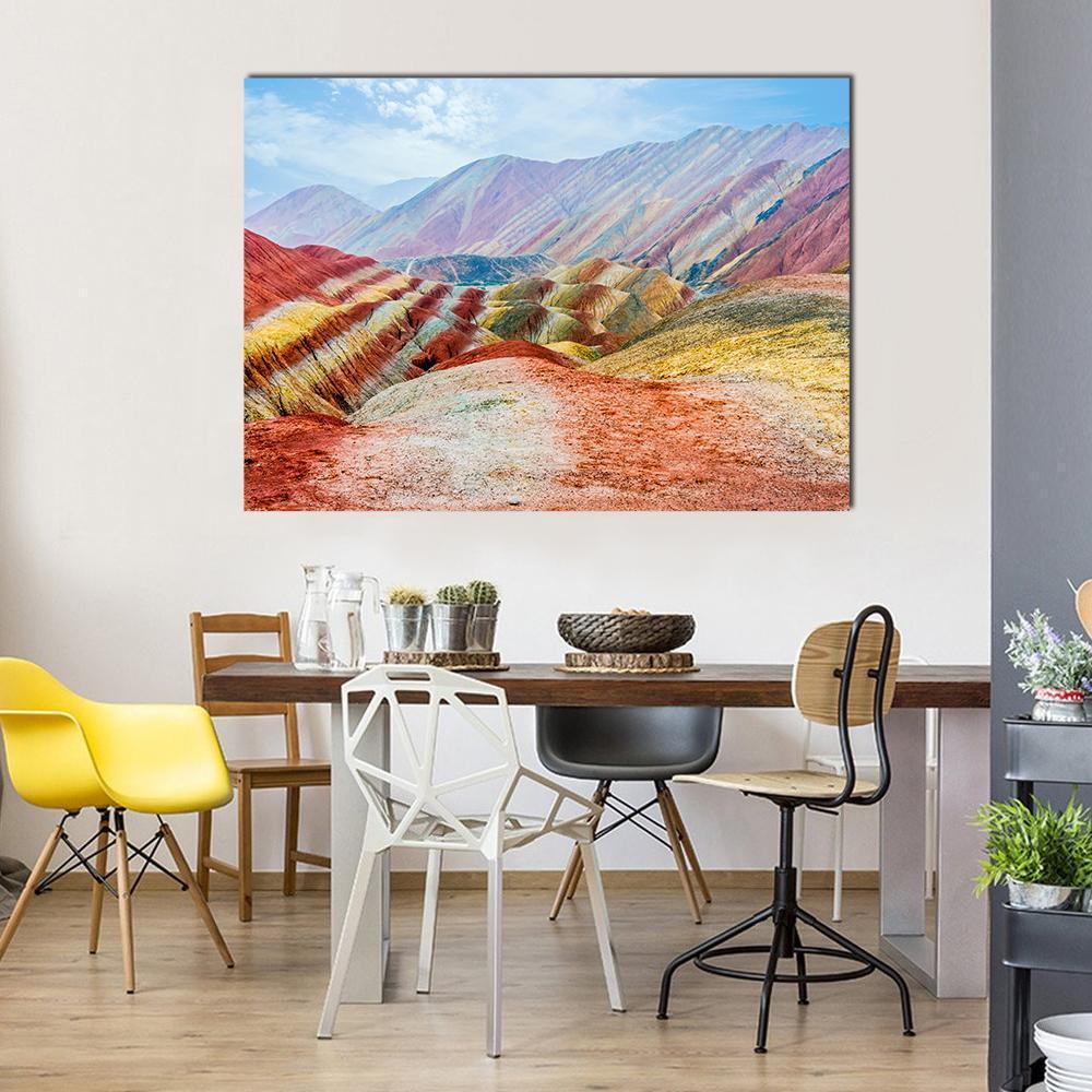 Zhangye Rainbow Mountains Under Daylight Canvas Wall Art in red, yellow and multicolor, single panel hung on a wall