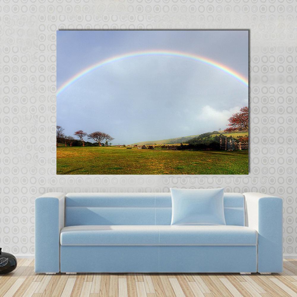 Rainbow Over a Farm Field Canvas Wall Art in gray, green and blue, single panel hung on a wall