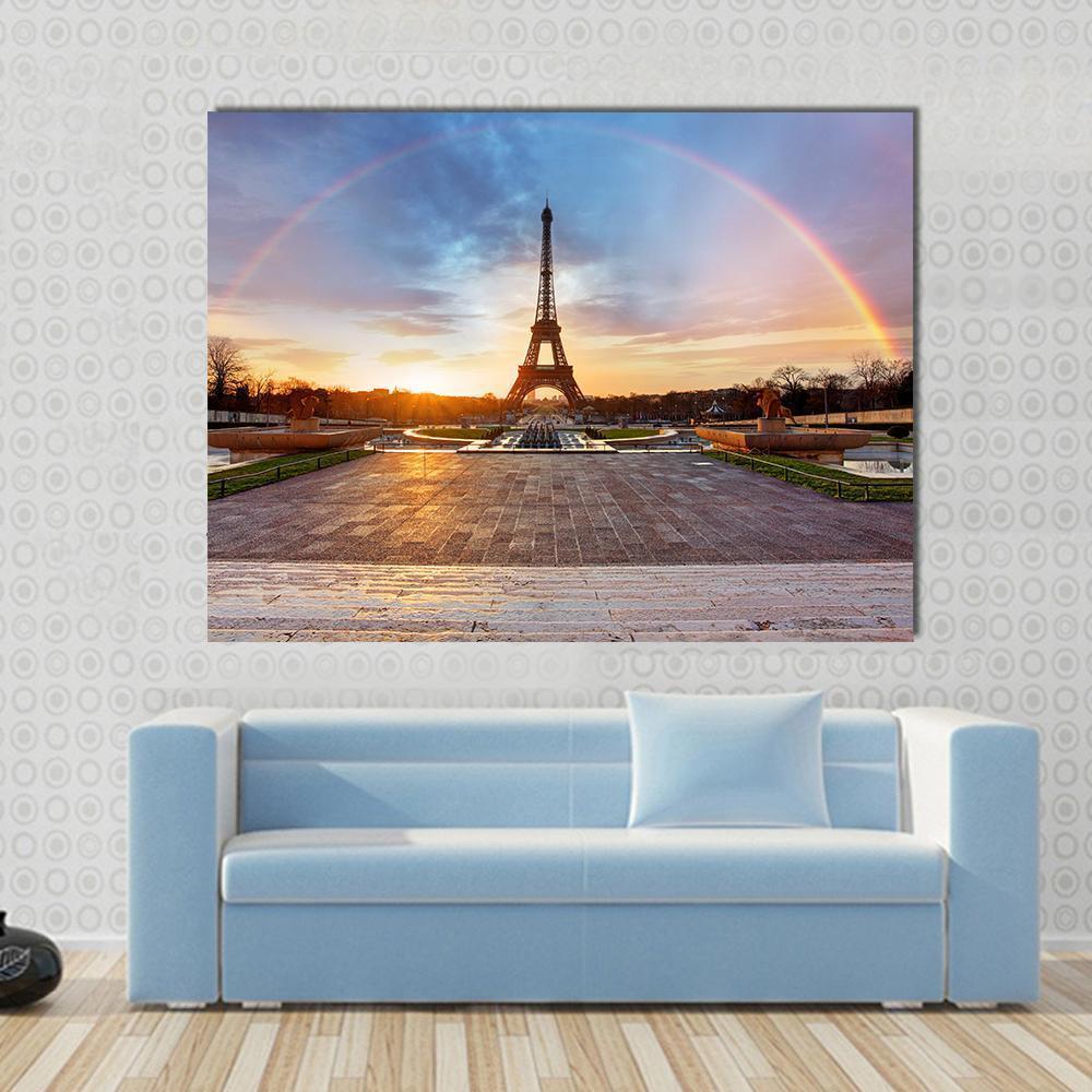 Rainbow Over Eiffel Tower Canvas Wall Art in orange, blue and multicolor, 3 panel horizontal set hung on a wall
