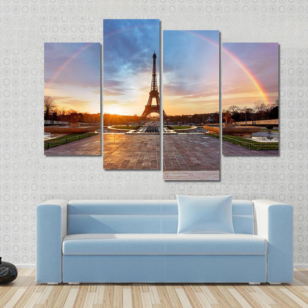 Rainbow Over Eiffel Tower Canvas Wall Art in orange, blue and multicolor, 3 panel horizontal set hung on a wall