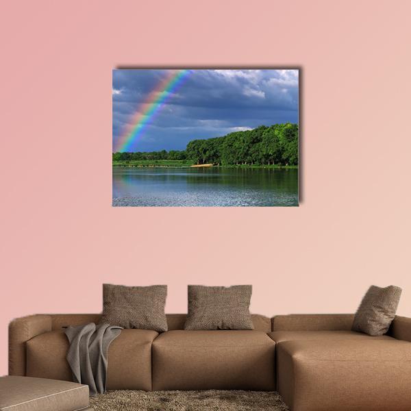 Close-up Rainbow Over the Lake Canvas Wall Art in green, blue and multicolor, single panel hung on a wall