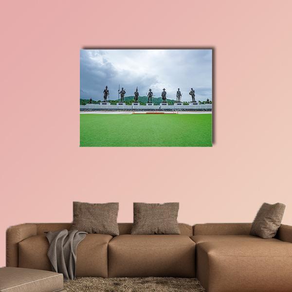Seven Kings Statues at Rajaphak Park Canvas Wall Art in gray, green and blue, single panel hung on a wall