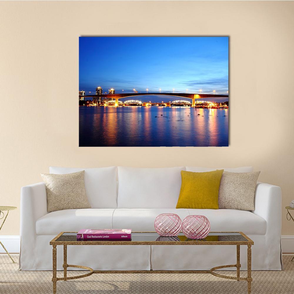 Rama 9 Bridge Night View Bangkok Canvas Wall Art in yellow and blue, single panel hung on a wall