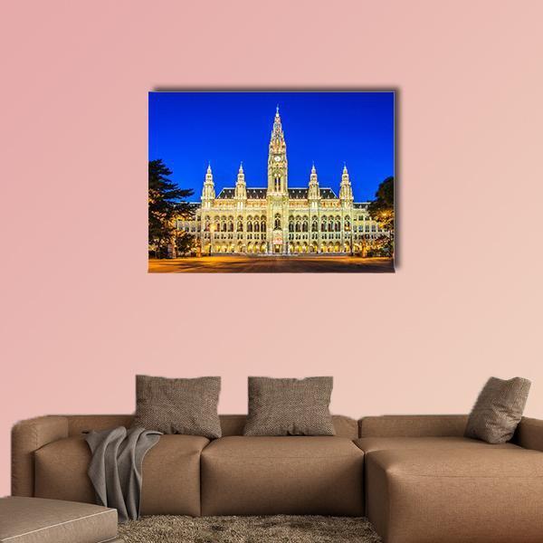 Vienna City Hall at Night Canvas Wall Art in gold, yellow and blue, single panel hung on a wall
