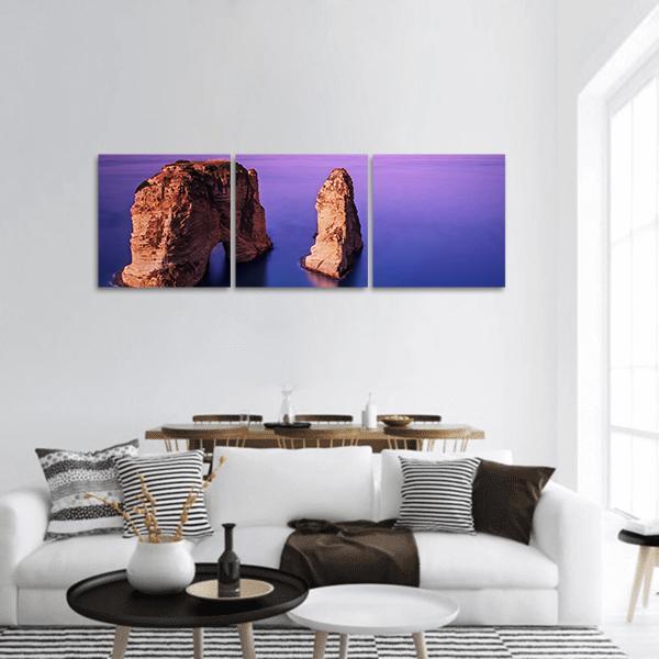 Rawsha Rock Natural Arch, Lebanon Panoramic Canvas Wall Art in brown, blue and purple, hung on a wall